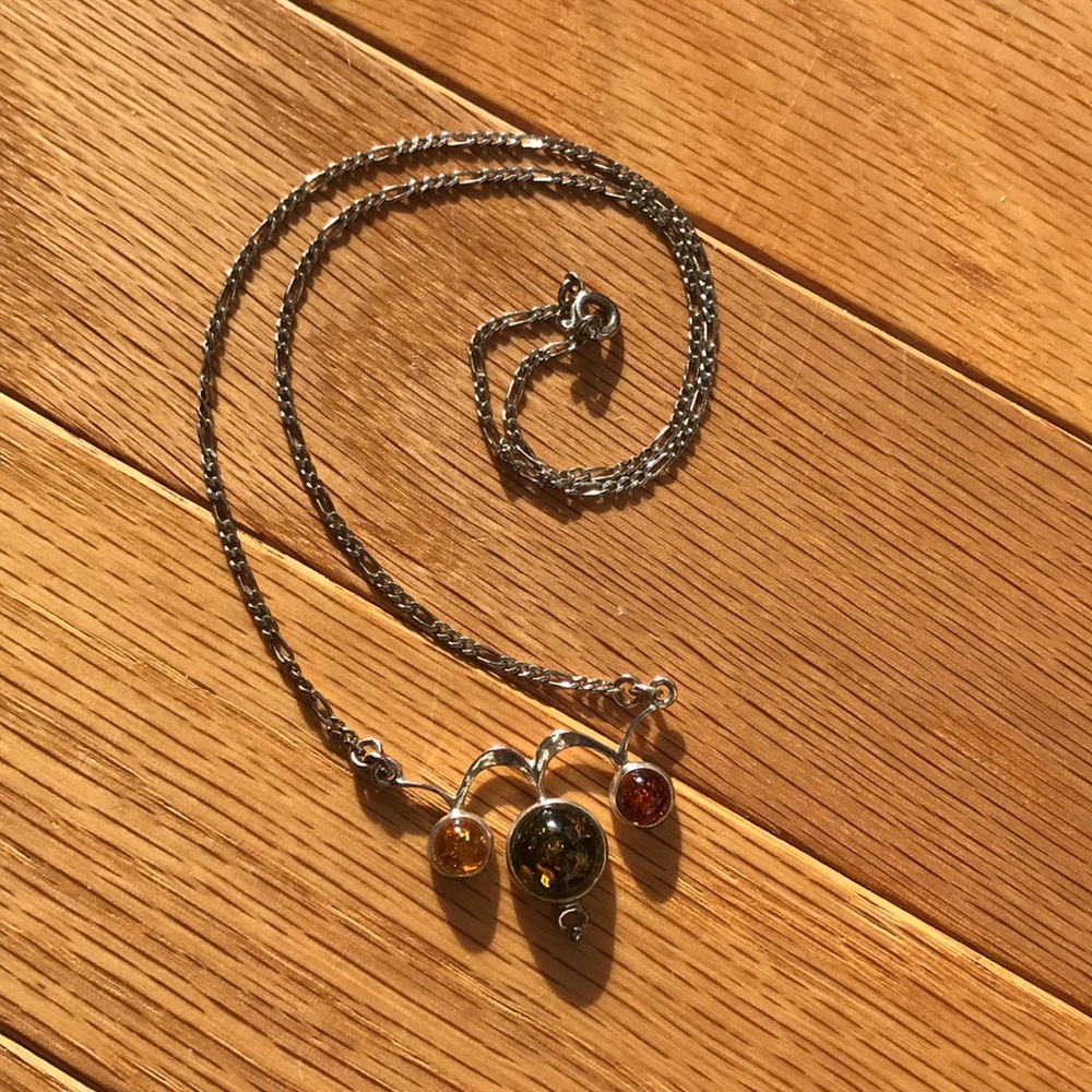 Tri-colored amber pendant on silver chain